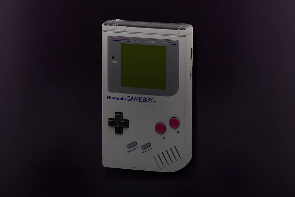 Original Game Boy in a dark bedroom